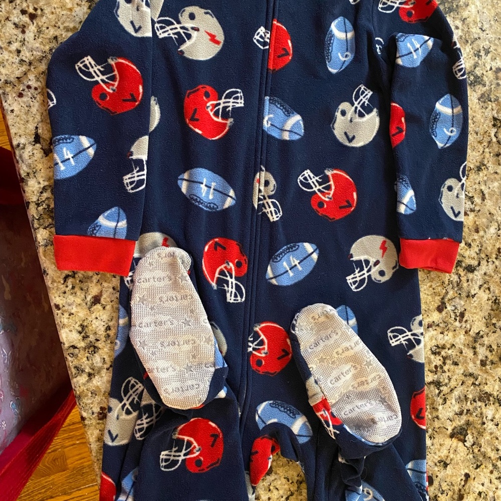 Boys zip up footed sleepers.